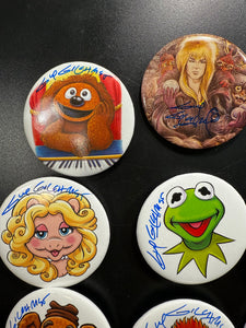 Select a 2.5” Button, art by Guy Gilchrist