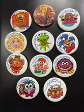 Load image into Gallery viewer, Select a 2.5” Button, art by Guy Gilchrist